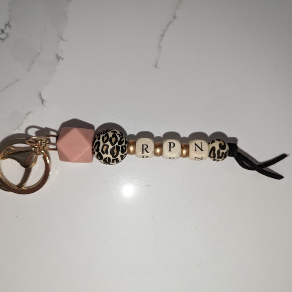 2/$40. 2 pack. MRS and RPN keychains. Brand new. Cheetah print. - Picture 2 of 2